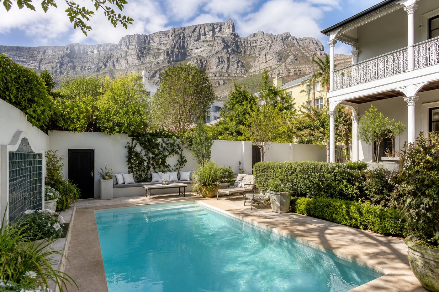 Compact courtyard swimming pool at a City Bowl Cape Town home with Table Mountain rising behind